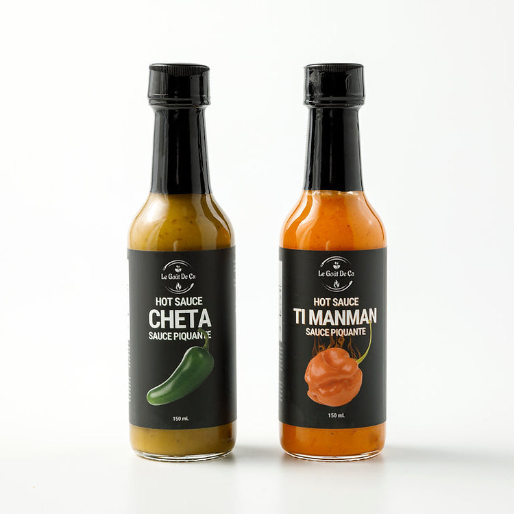 Front view of bottles of Cheta and Ti Manman hot sauces by Le Gout de Ca