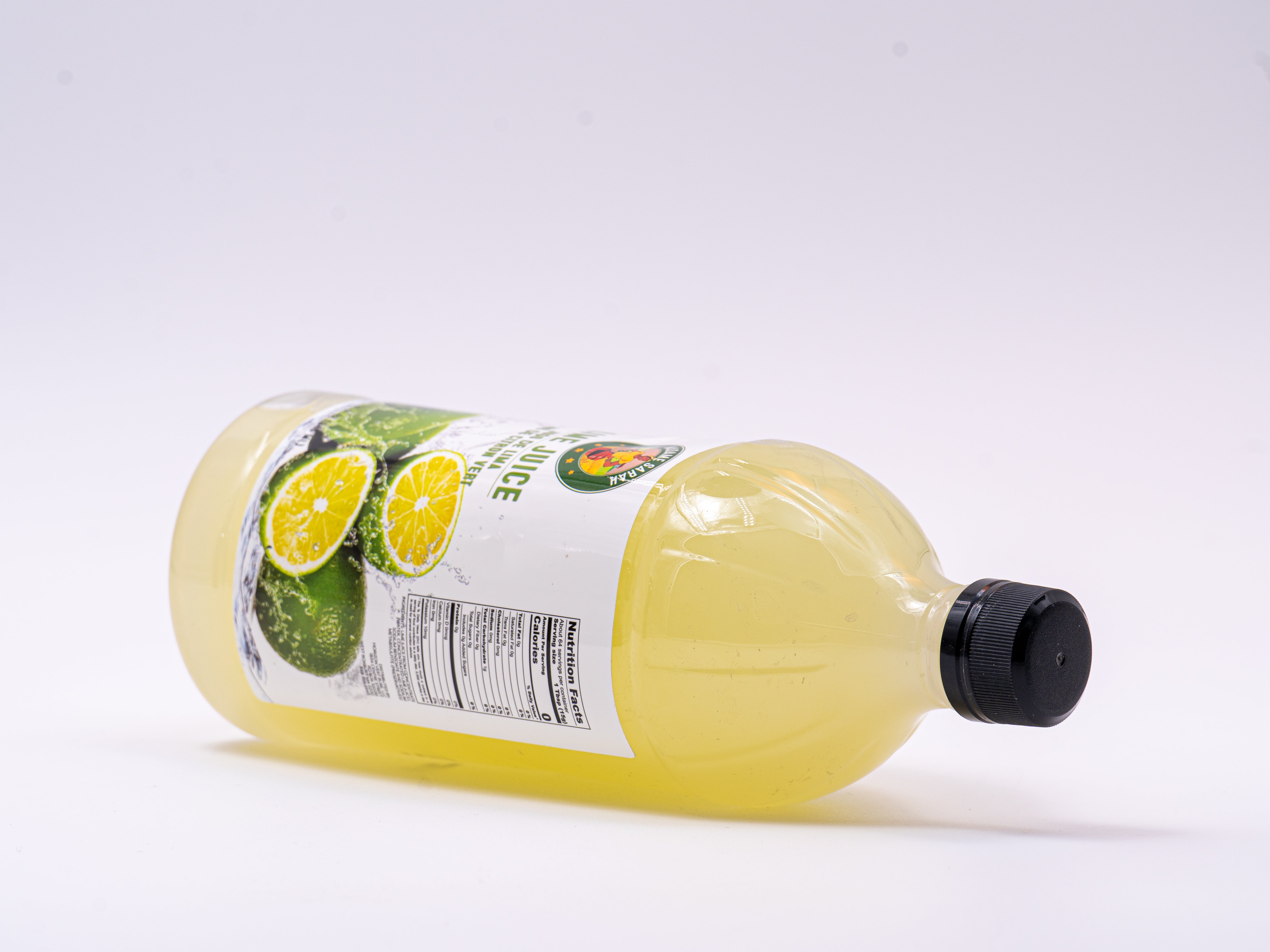 Madame Sarah Lime Juice bottle on its side