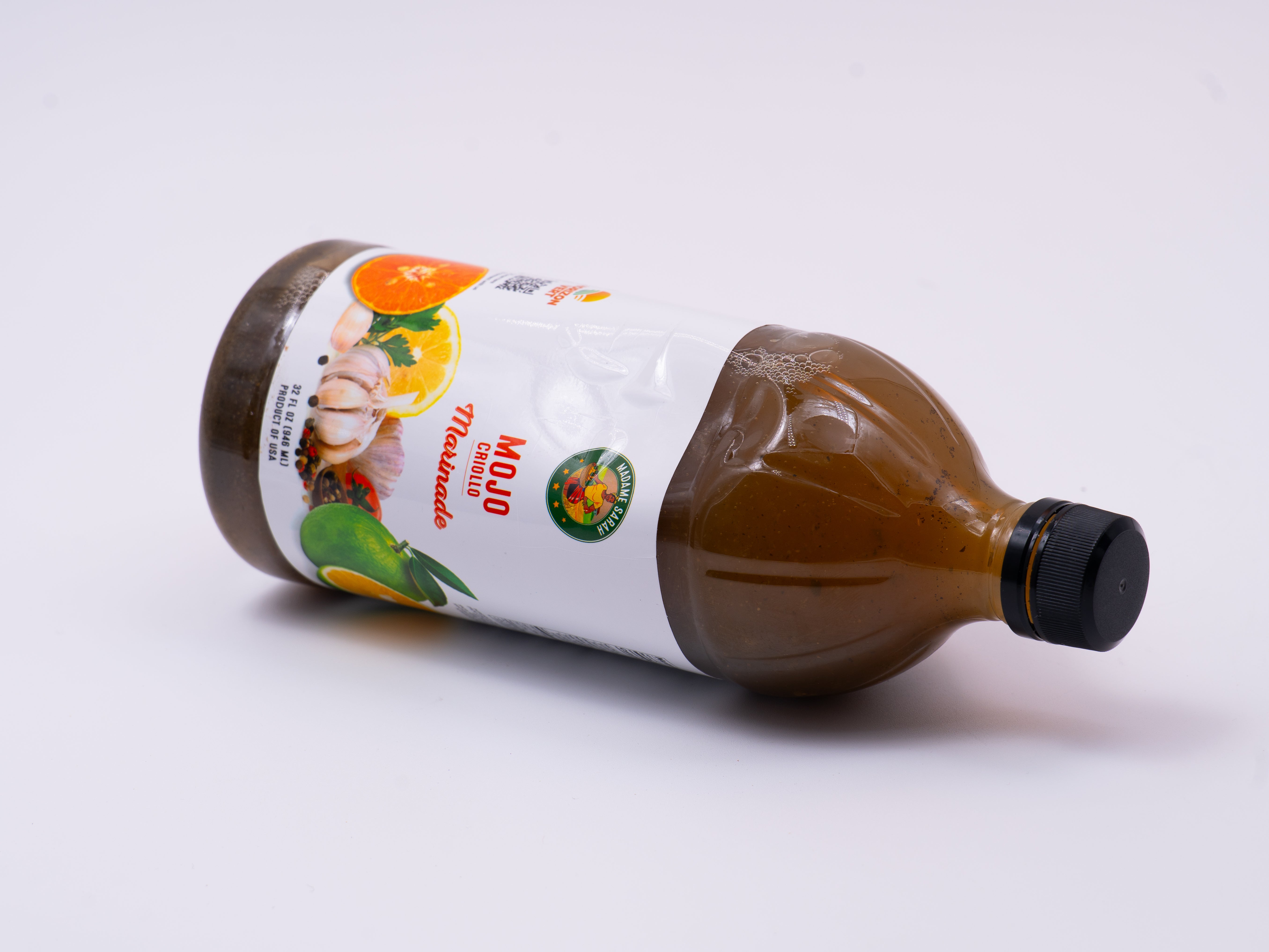 Madame Sarah Mojo Marinade bottle on its side